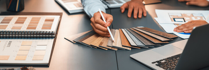 Group of interior designer team in meeting, discussing with engineer on interior design and planning for house project blueprint and model, choosing various mood board materials. Insight © InfiniteFlow