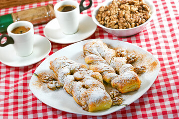 Crispy walnut cake,  baking strudel with walnuts and coffee on the table - 644241523