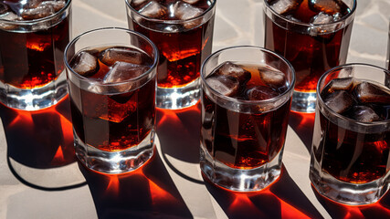 Glasses of Coke with Ice on a Table. generative ai
