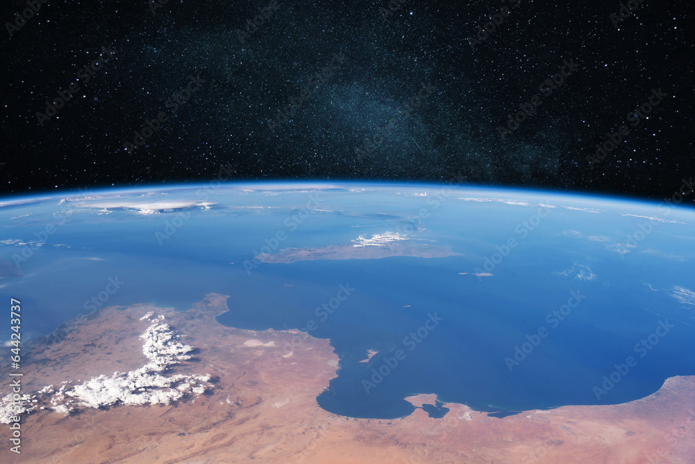 Poster blue amazing planet earth with ocean and continents in open space in the starry space.