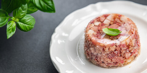 meat brawn food Sülze piece of meat in jelly pork, beef meat ready to eat meal food snack on the table copy space food background rustic top view