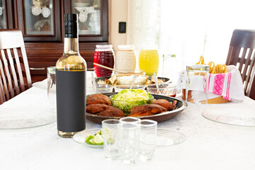 Dining room of a Mexican house without people with the table set with traditional Mexican food