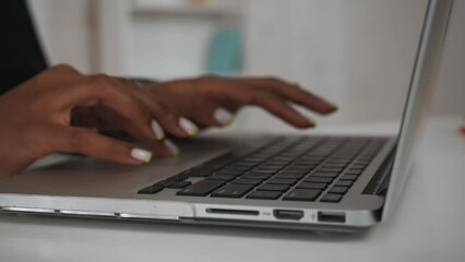 Modern businesswoman creative concept. Closeup shot of the woman at the desk, female hands typing something on keyboard and closing laptop.