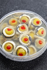 olive stuffed anchovy fillet, anchovys roll stuffed olives apetizing seafood fish marinated ready to eat appetizer meal food snack on the table copy space food background rustic top