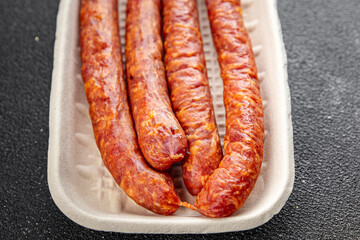 sausage meat pork, beef, lamb or chicken fresh appetizer meal food snack on the table copy space...