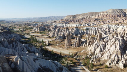 A drone shot of the Meskendir Valley, Cappadocia with a view of the Red Valley in the Background - obrazy, fototapety, plakaty