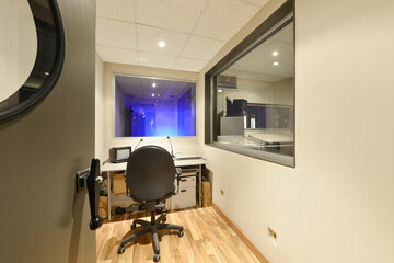 A small support room to a sound recording room.