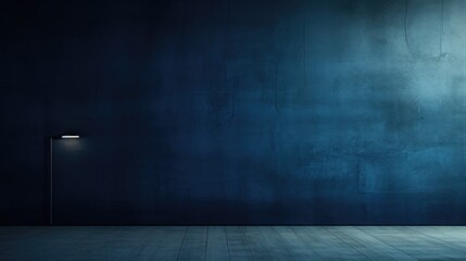 An image of a dark blue wall bathed in dramatic and moody lighting.