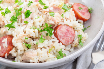 Traditional South Carolina chicken bog dish with smocked sausages, in bowl, horizontal, closeup