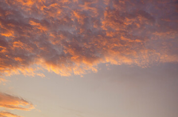 Beautiful orange fluffy clouds in morning light