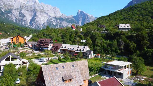Aerial drone view of the rustic homes in Theth National Park, Albania. Albanian Alps