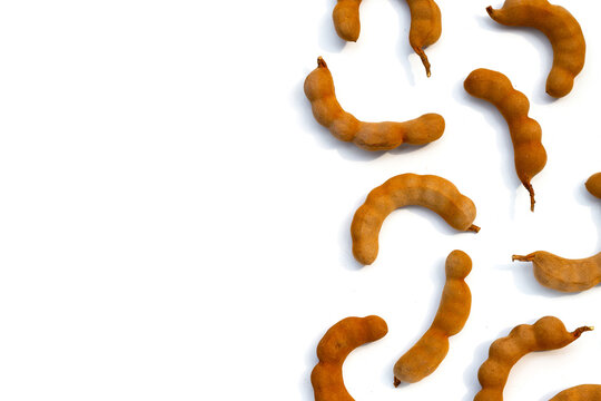 Tamarind fruit on white background.