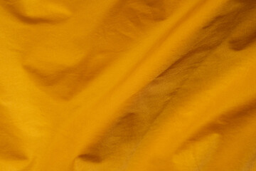 ocher wrinkled fabric background texture