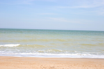 Fototapeta na wymiar Sand beach with sea and sky. Holiday summer beach