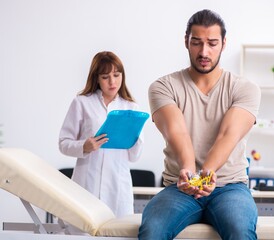 Male diabetic patient visiting young female doctor