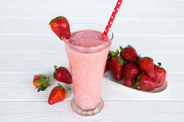 Strawberry yogurt fruit juice smoothie pink colorful fruit juice milkshake blend beverage healthy high protein the taste yummy In glass drink episode morning on white wood background.