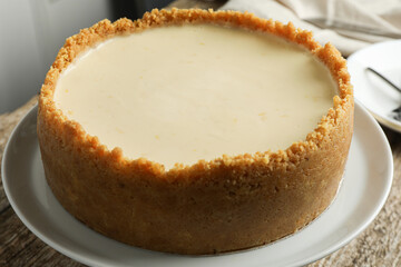Tasty vegan tofu cheesecake on table, closeup