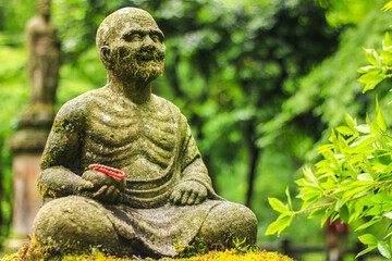 Jizo statuary is a stone guardian statue according to Japanese beliefs.in the Park of Japan temple.