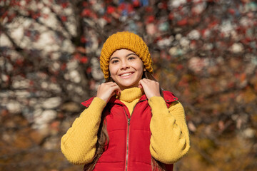 glad teen girl at school time outdoor in autumn season