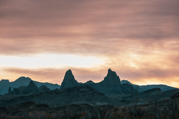 Mule Ears Below Menacing Sky In Big Bend