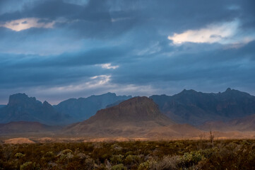Fototapeta na wymiar Nugent Mountain With Silhouetted Chisos Mountains In The Distance