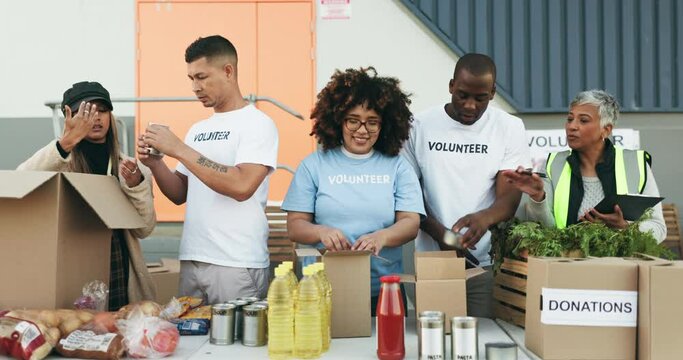 Happy people, volunteer and box in donations, teamwork or community service together in NGO. Group of volunteering workers or team packing parcel, package or boxes in charity, social or contribution