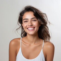 portrait of a beautiful young latin model woman laughing and smiling with clean teeth - obrazy, fototapety, plakaty