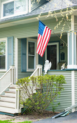 suburban house property with american flag. property insurance. real estate. residential house...