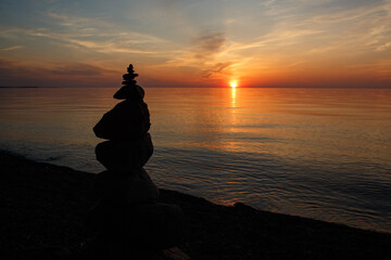 Silhouette of a Rock Cairn on the Beach at Chimney Bluffs State Park