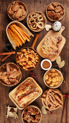 Fototapeta na wymiar Fried meat food, unhealthy diet, indoor wooden table background, various fried foods placed on the table