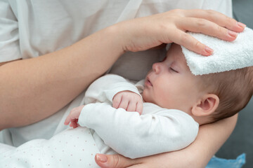 Mother's remedy for baby's high temperature, Concept of natural methods for soothing fever - obrazy, fototapety, plakaty