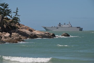 HMAS Adelaide Australian landing helicopter dock ship passing by Magnetic Island Queensland...