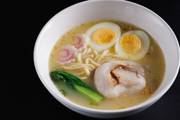 Ramen Japanese noodle isolated in black background