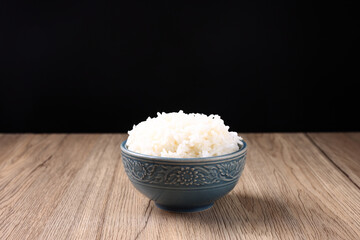Thai rice isolated on wood background