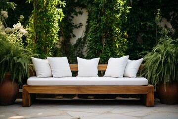 Outdoor wooden bench on a wooden terrace with green bush fence, wood décor, and white fabric furniture. Generative AI