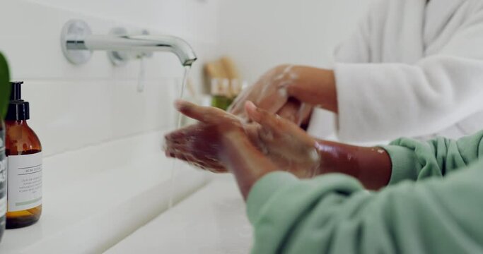 Closeup, mom or kid cleaning hands for hygiene, wellness or health in morning routine in family home. Care, tap water or mother washing fingers with a child in the bathroom to stop bacteria or germs