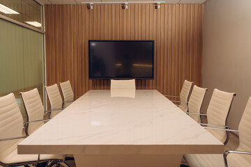 Modern conference room with furniture, laptops, Coworking meeting room.