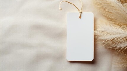 white blank tag with a rope for mockup on cream color background