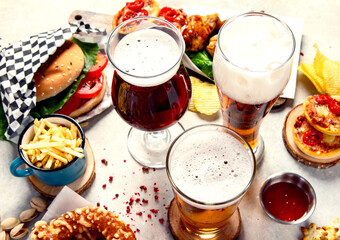 A selection of beer and snacks. Light beer, dark beer, live beer.