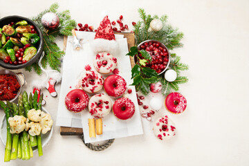 Delicious Christmas themed dinner table with roasted meat, appetizers and desserts. Holiday concept.