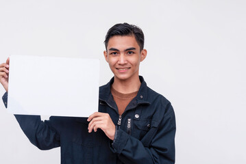 A typical young asian man holding a blank white signage Isolated on a white background.