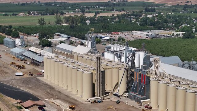 Aerial Sutter California rice elevator solar panels 2. Economy based on farming rice, grains, walnuts peaches and cattle ranch. Fields act as wetlands for waterfowl and birds.