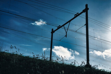train infrastructure electricity pole along a railway track