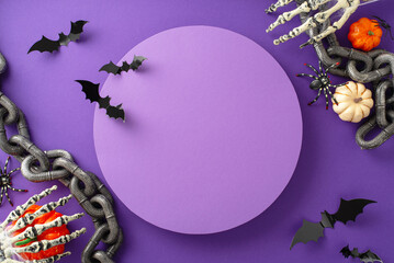 Festive Halloween party vision. High-angle shot showcasing pumpkins, paper bats, spiders, chains and other Halloween-themed embellishments on a purple isolated surface. Ideal for text or marketing use