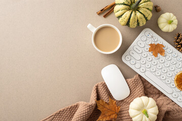 Cozy Fall Office Vibes: Top view shot of keyboard, warm knitted sweater, coffee cup, autumnal decor...