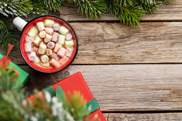 Cup with marshmallow and xmas gift boxes