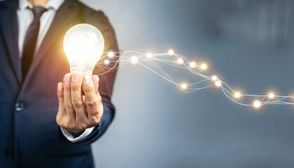 person holding light bulb on hand