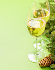 Christmas fir tree branch, champagne and space