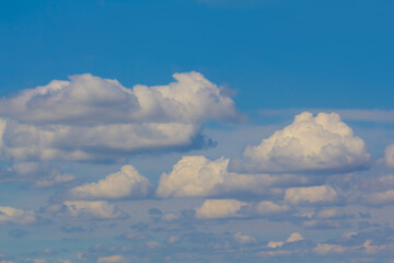closeup huge cumulus clouds on blue sky
