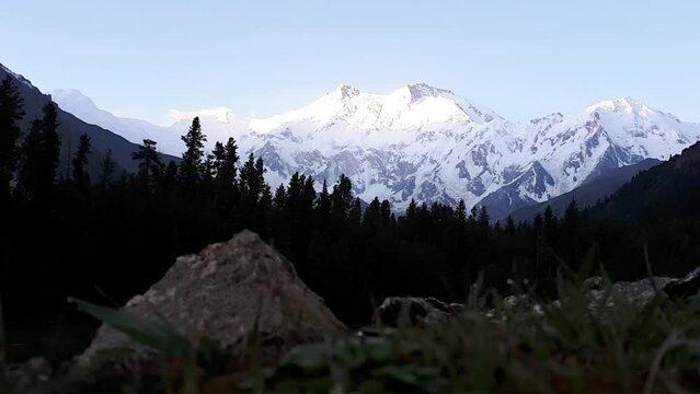 Nature in full swing, view of sun rise over nanga parbat killer mountain in Fairy Meadows